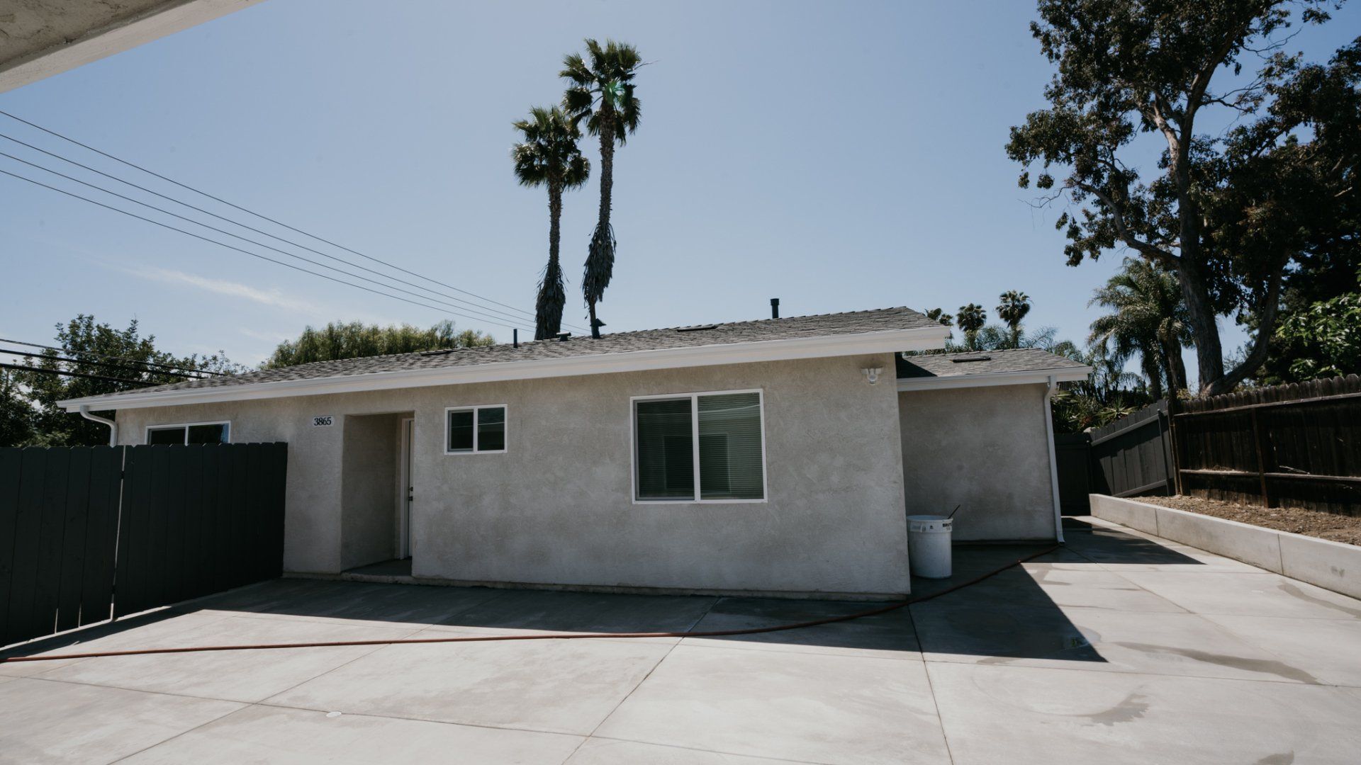A house with two palm trees on top of it