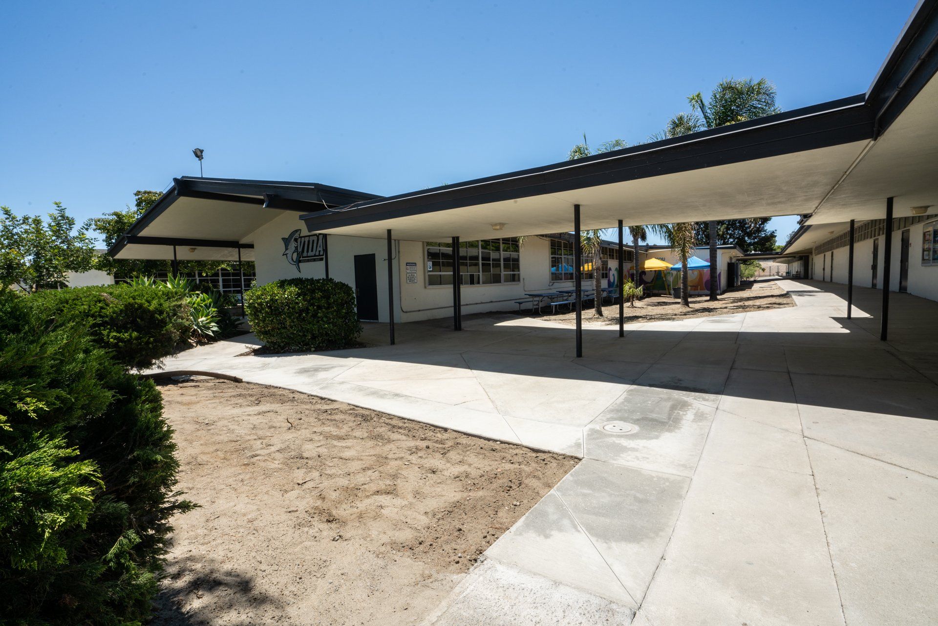A building with a covered walkway leading to it
