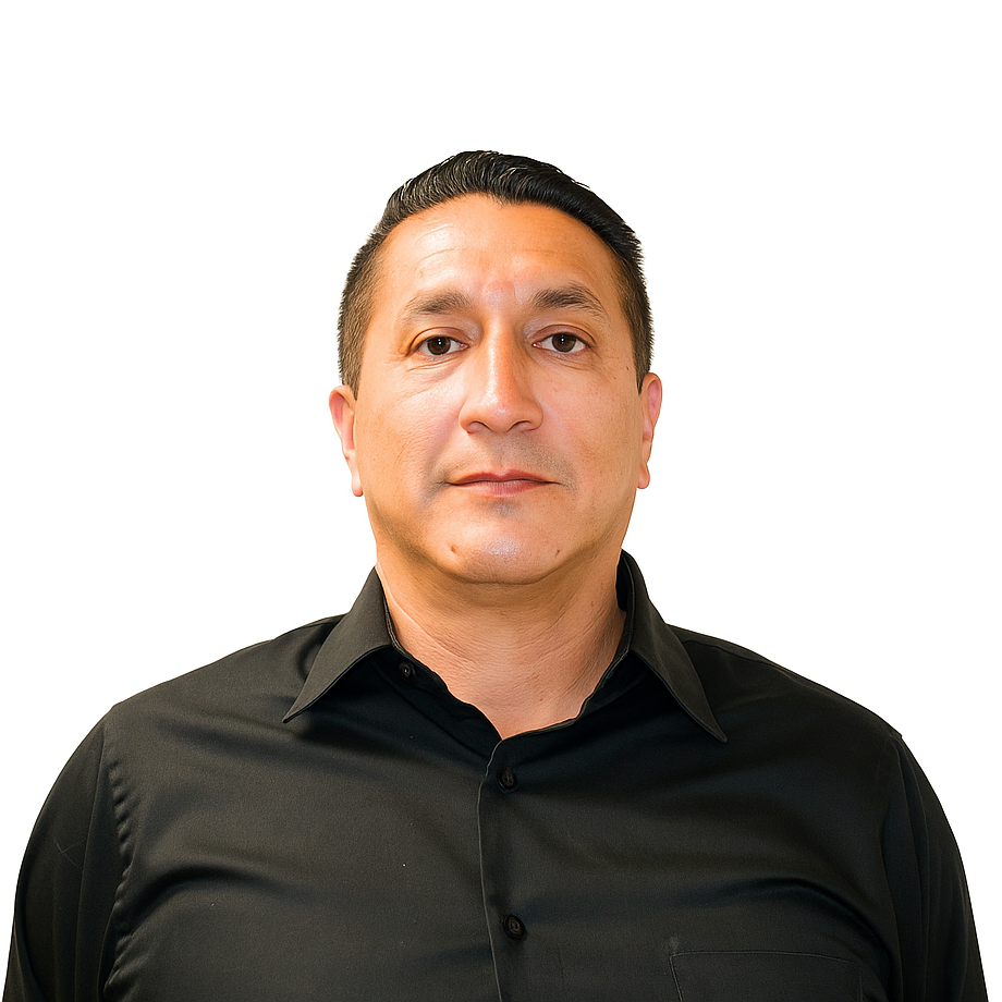 A man in a black shirt stands in front of a white background