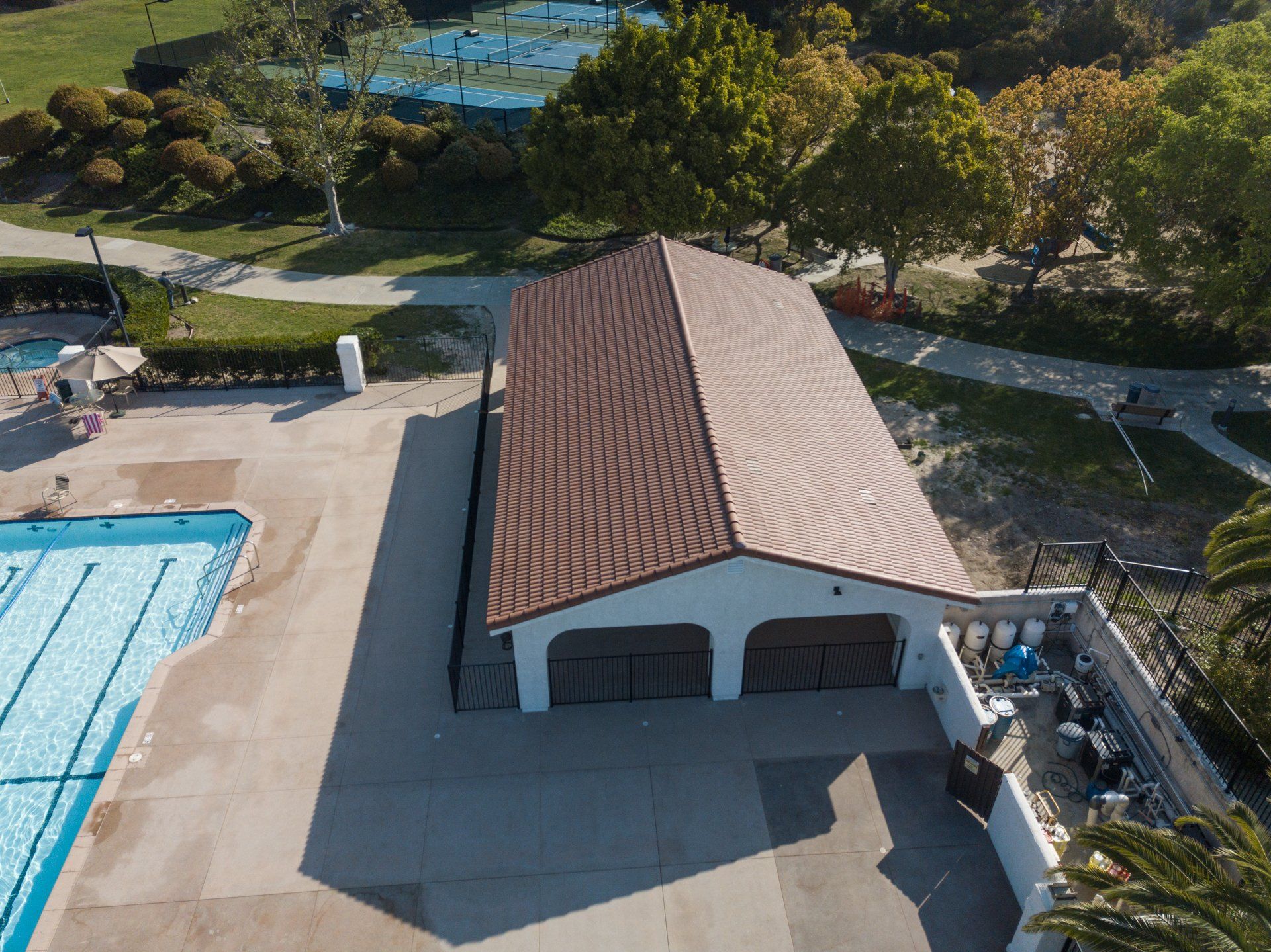 An aerial view of a building next to a swimming pool.