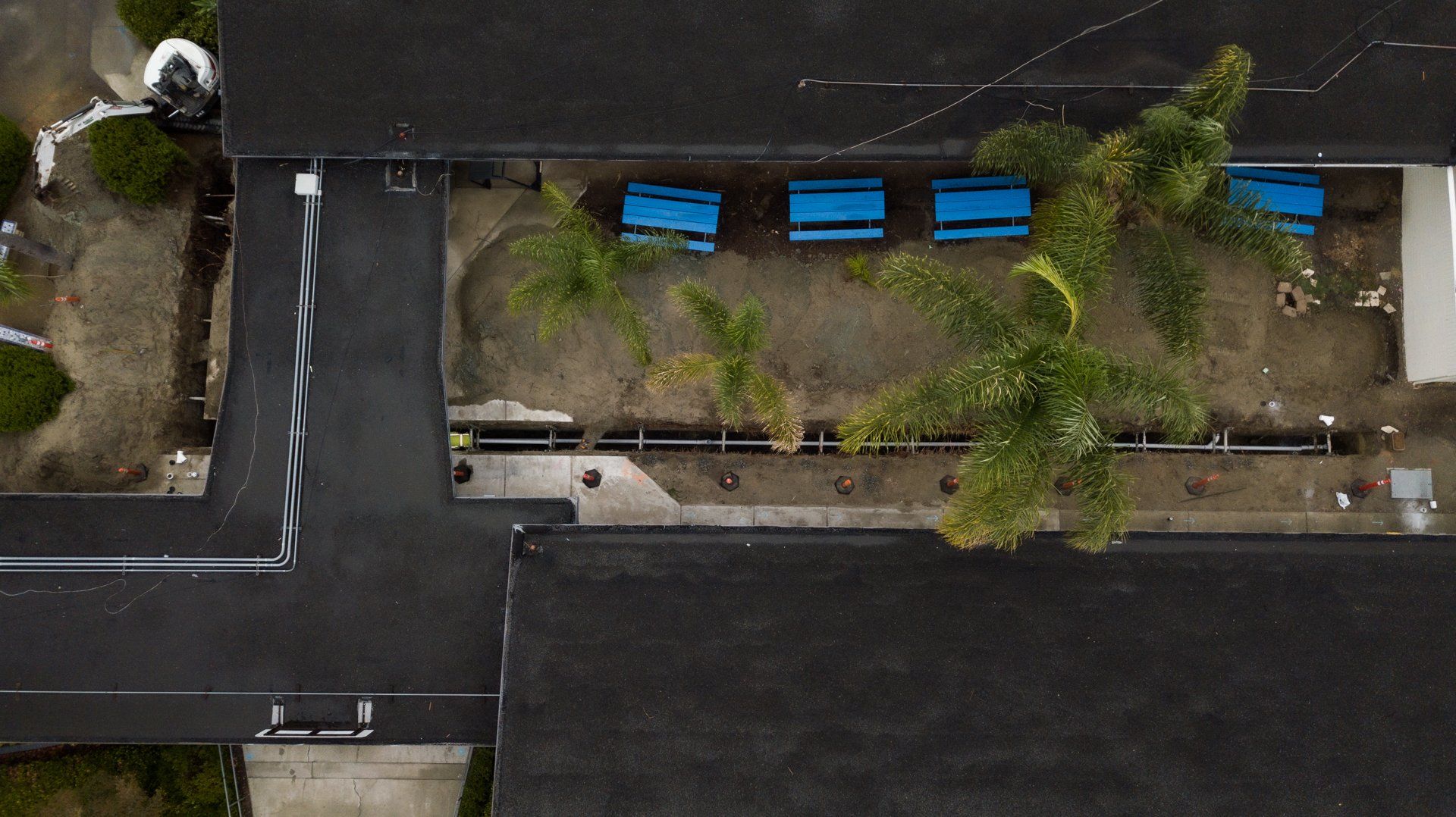 An aerial view of a building with a lot of trees