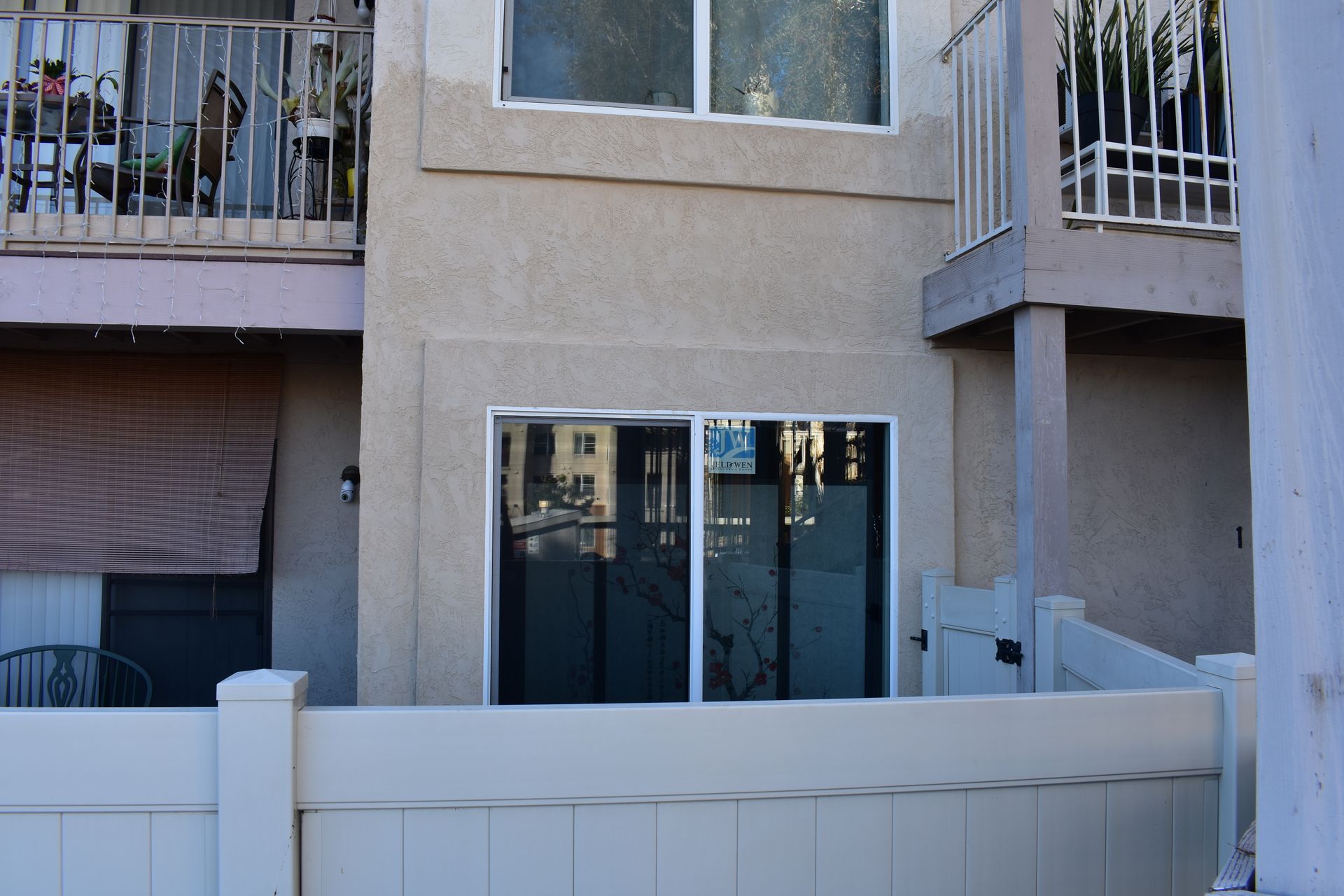 A building with a white fence in front of it