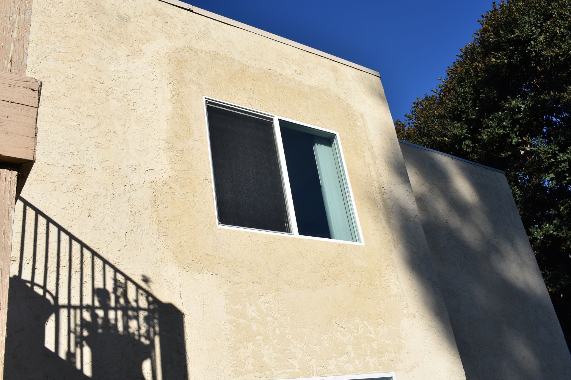 A building with stairs and a window on the side