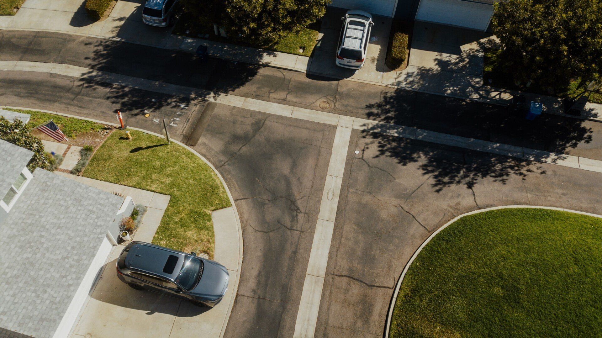 An aerial view of a car parked at an intersection