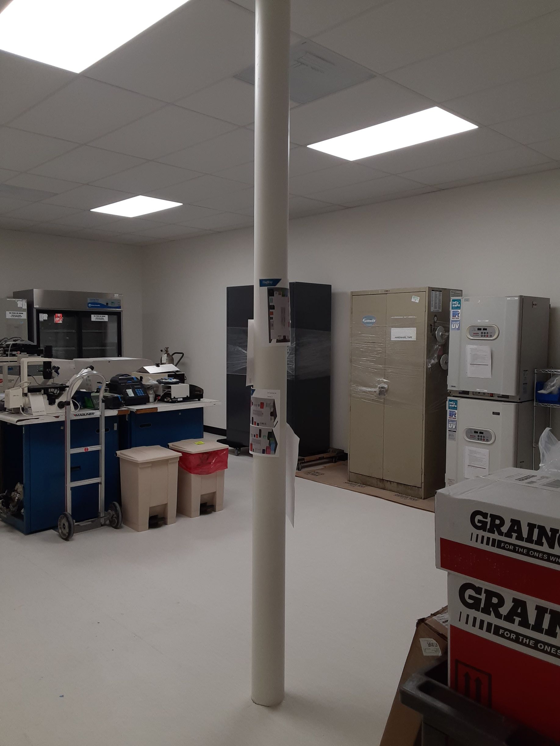 A room with a pillar and a box that says grains on it