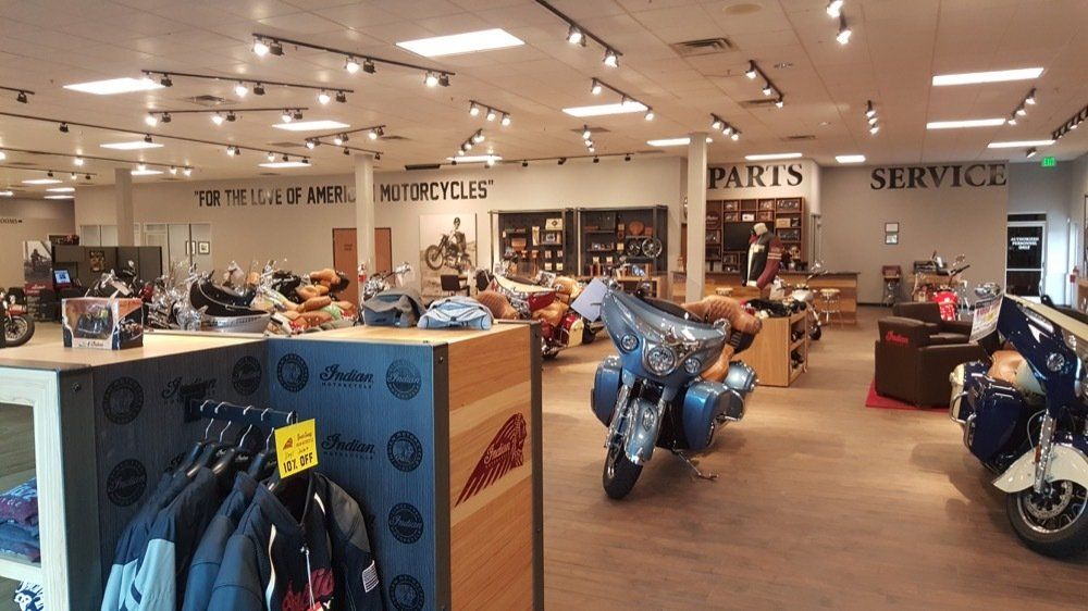 A motorcycle is on display in a motorcycle dealership