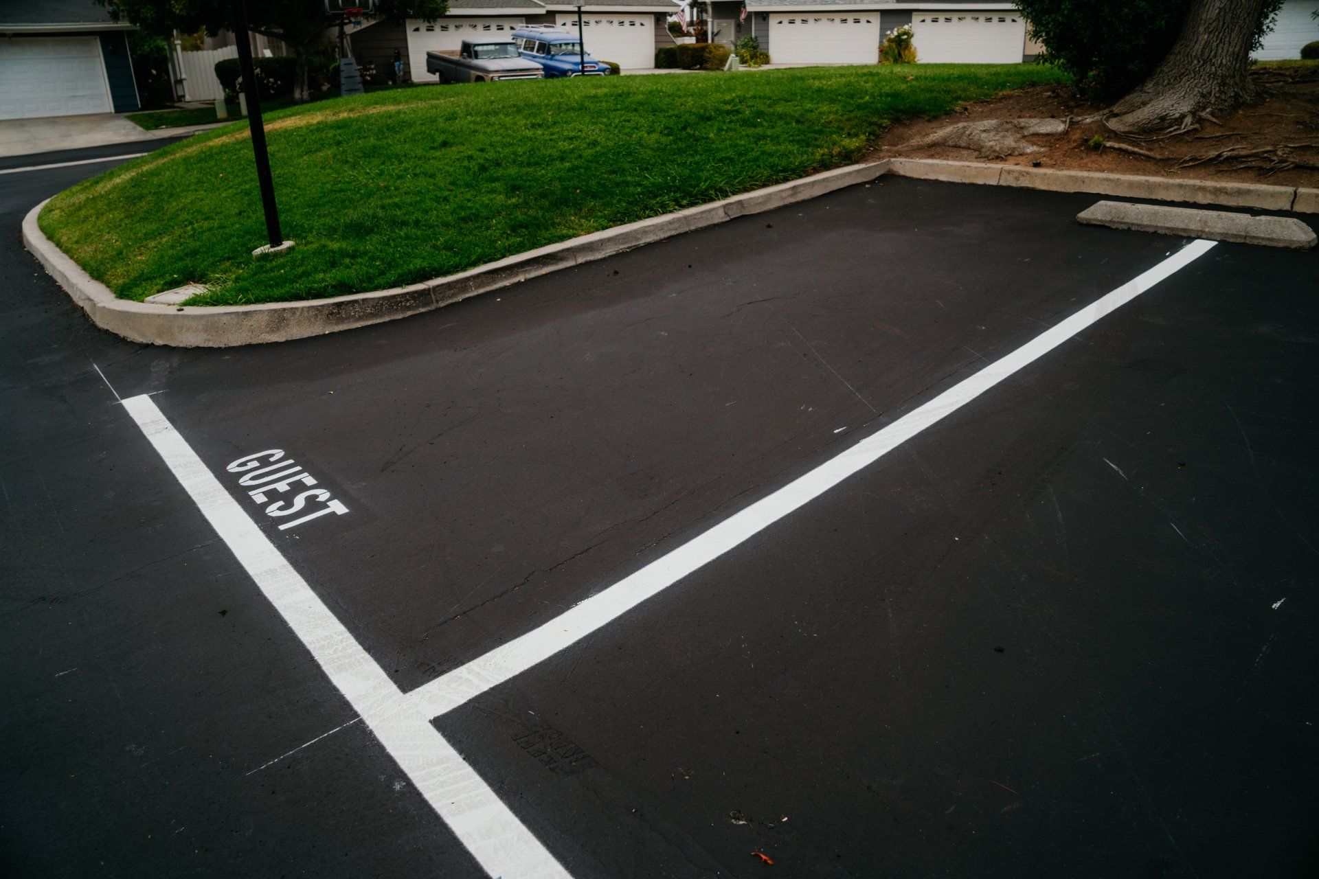 A parking lot with a white line that says first on it