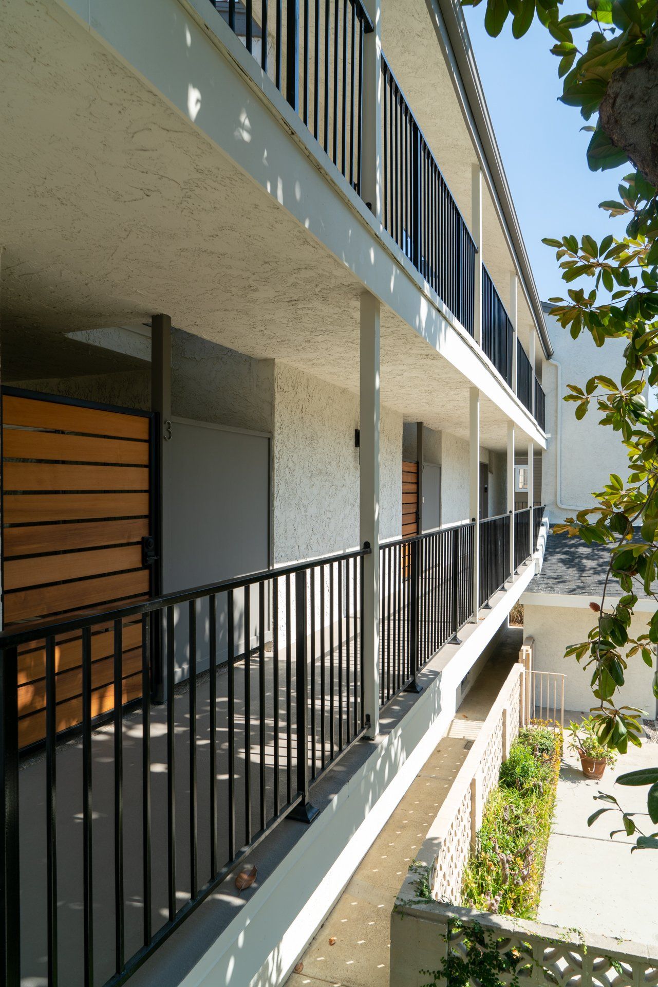 A building with a balcony and a black railing