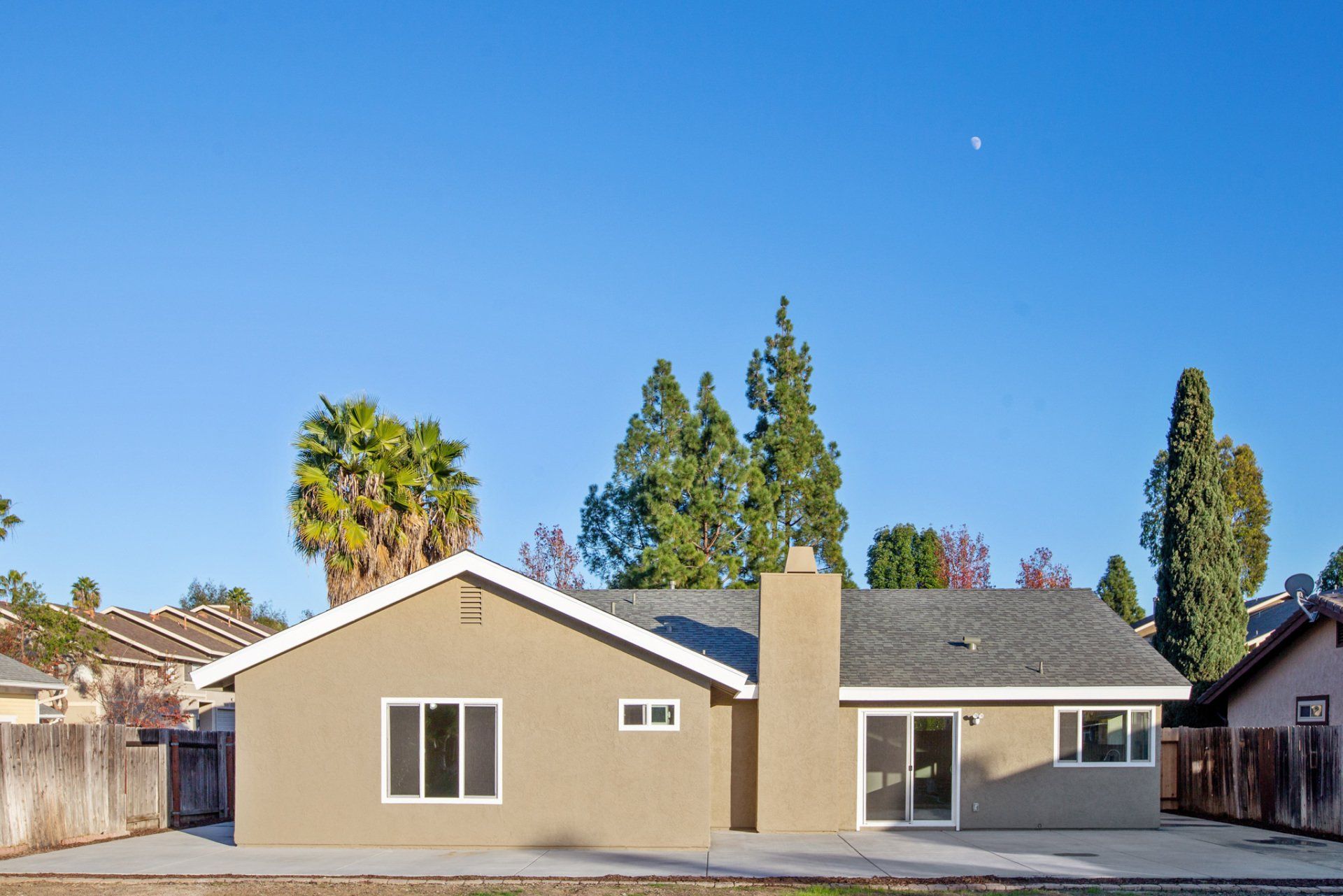 The back of a house with a sliding glass door