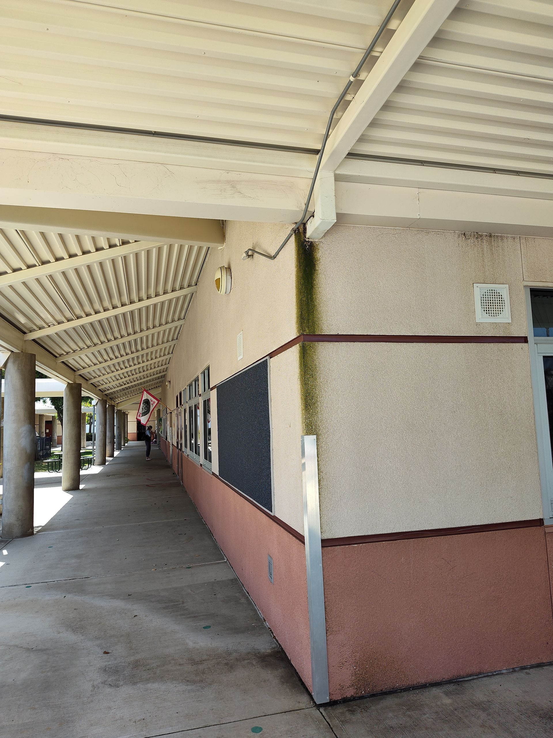 A building with a covered walkway between two buildings