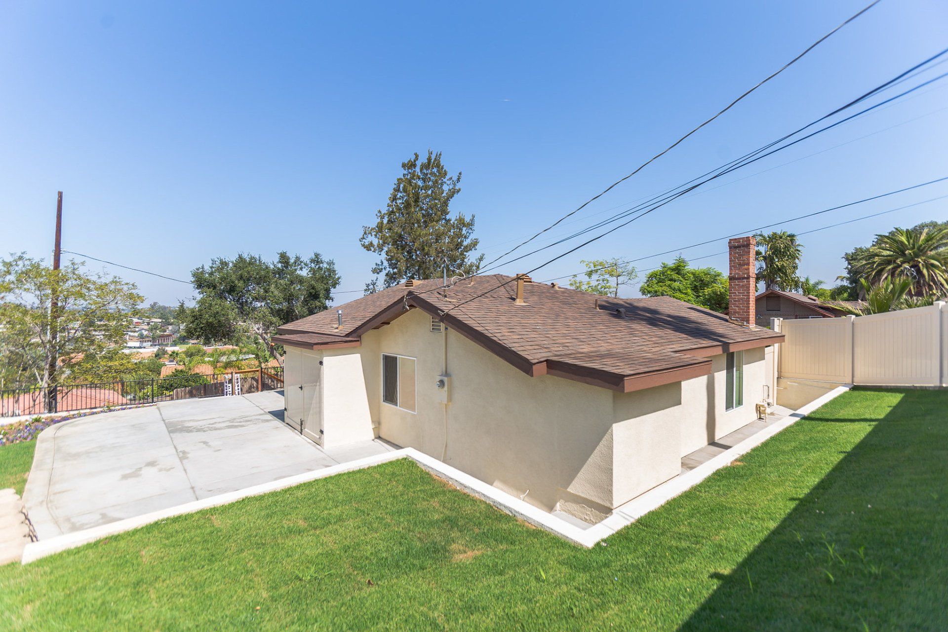 A house with a roof that has a chimney on it