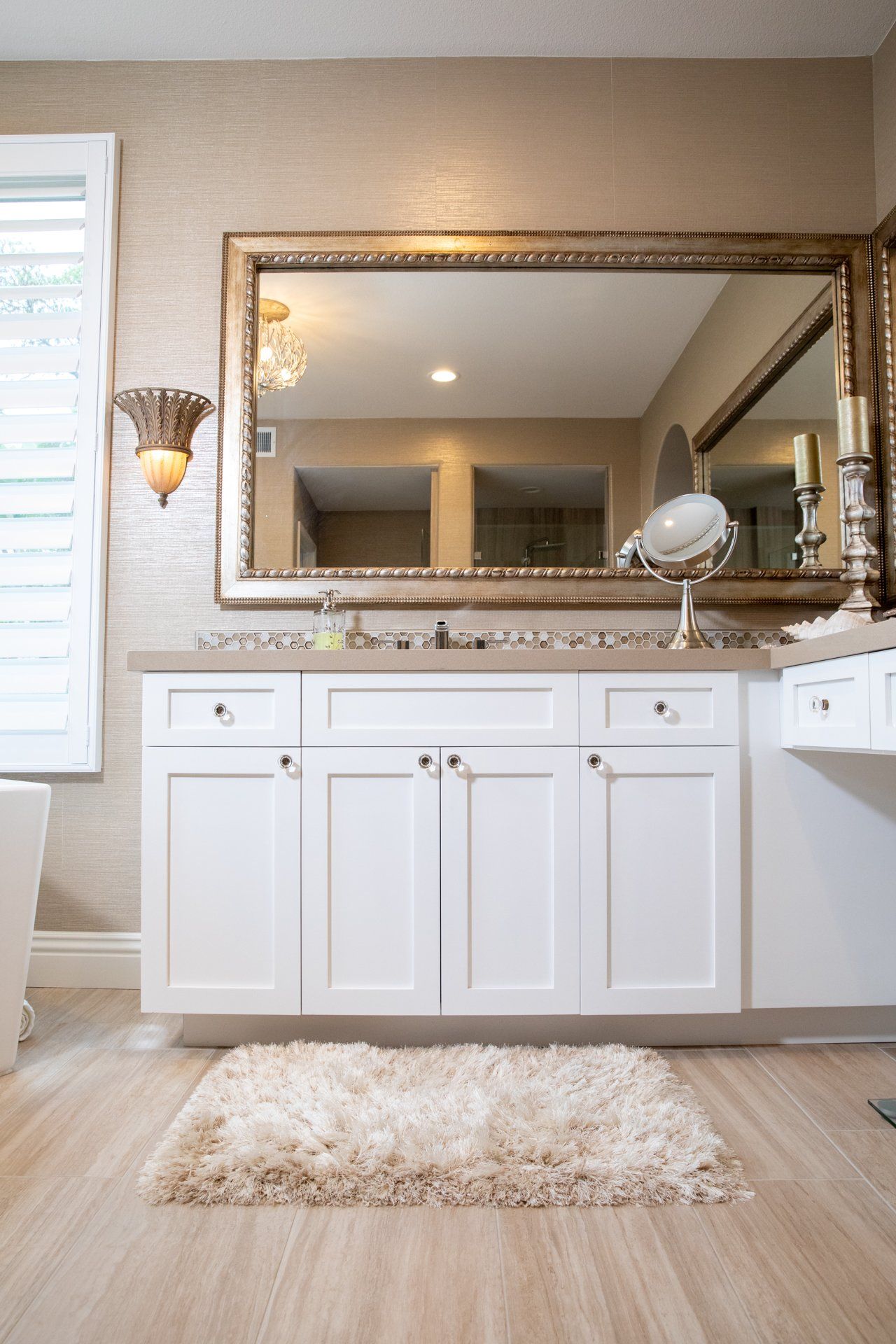 A bathroom with two sinks and a large mirror