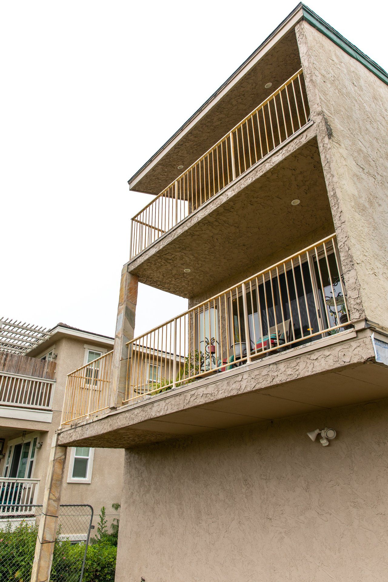 A building with a balcony on the top of it