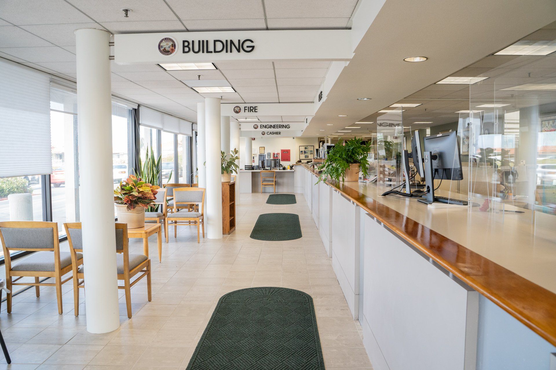 A long hallway in a building with a sign that says building on it.