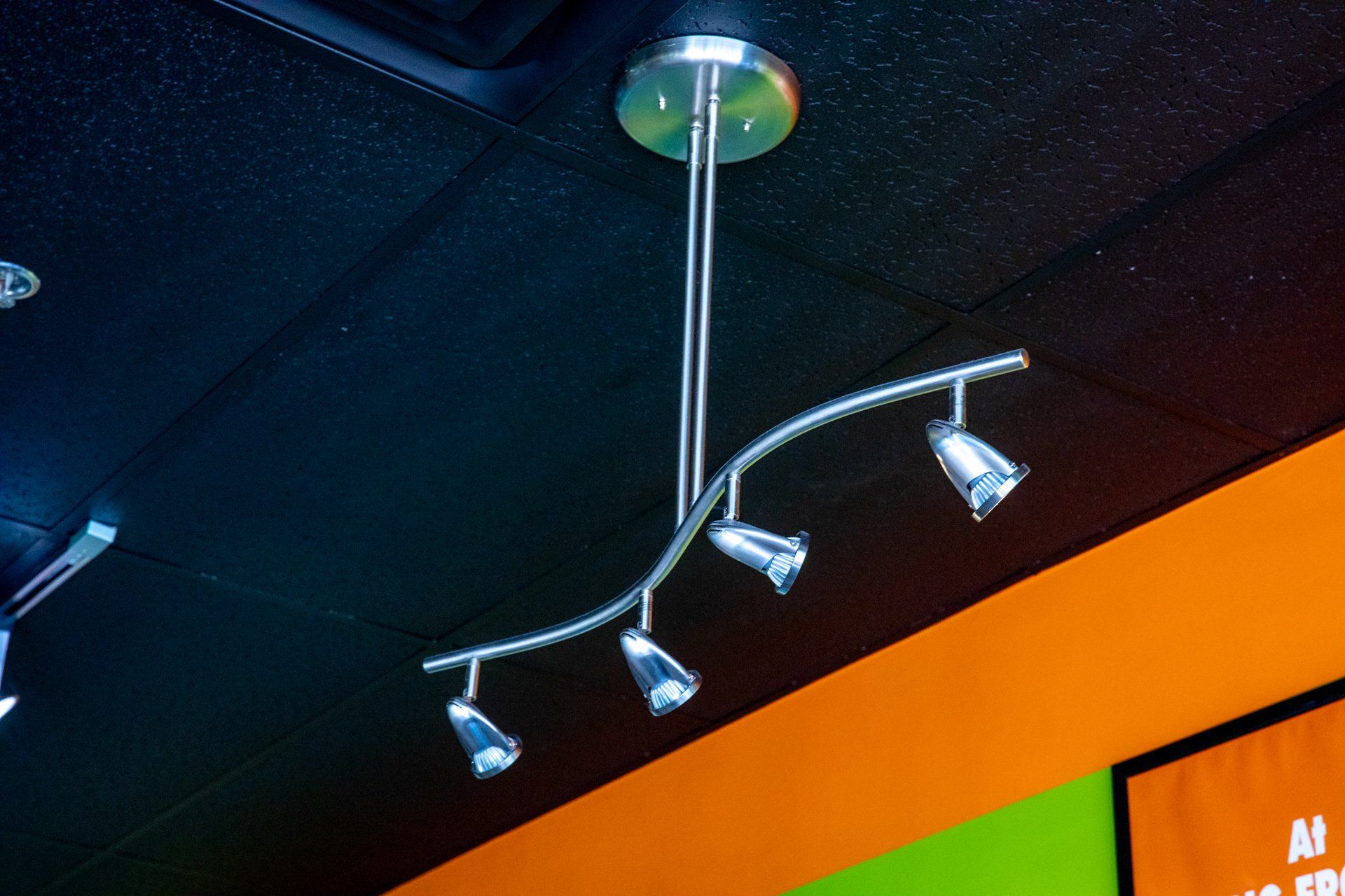 A ceiling light with four lights hanging from it