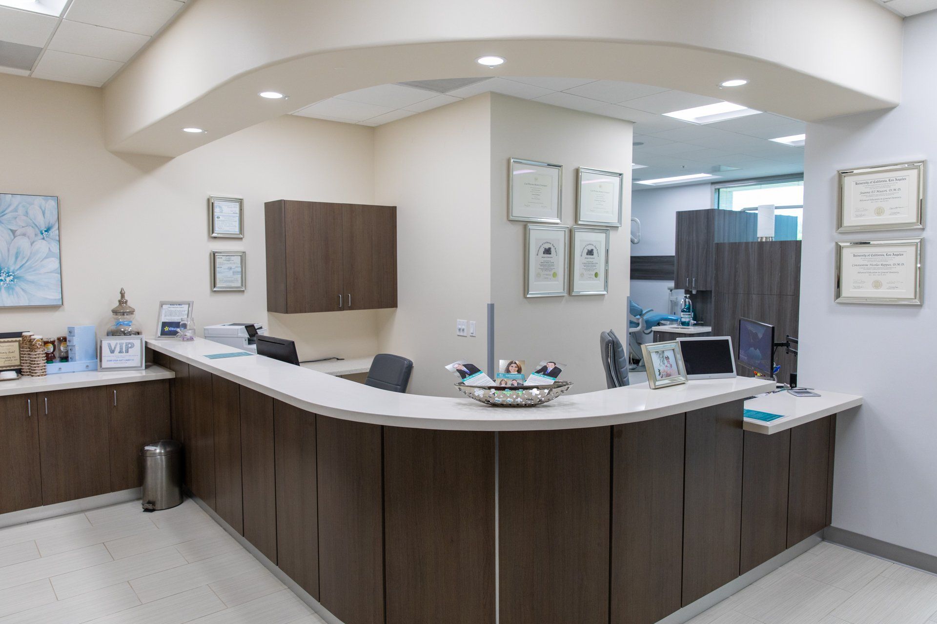 A reception area in a medical office with a curved counter.