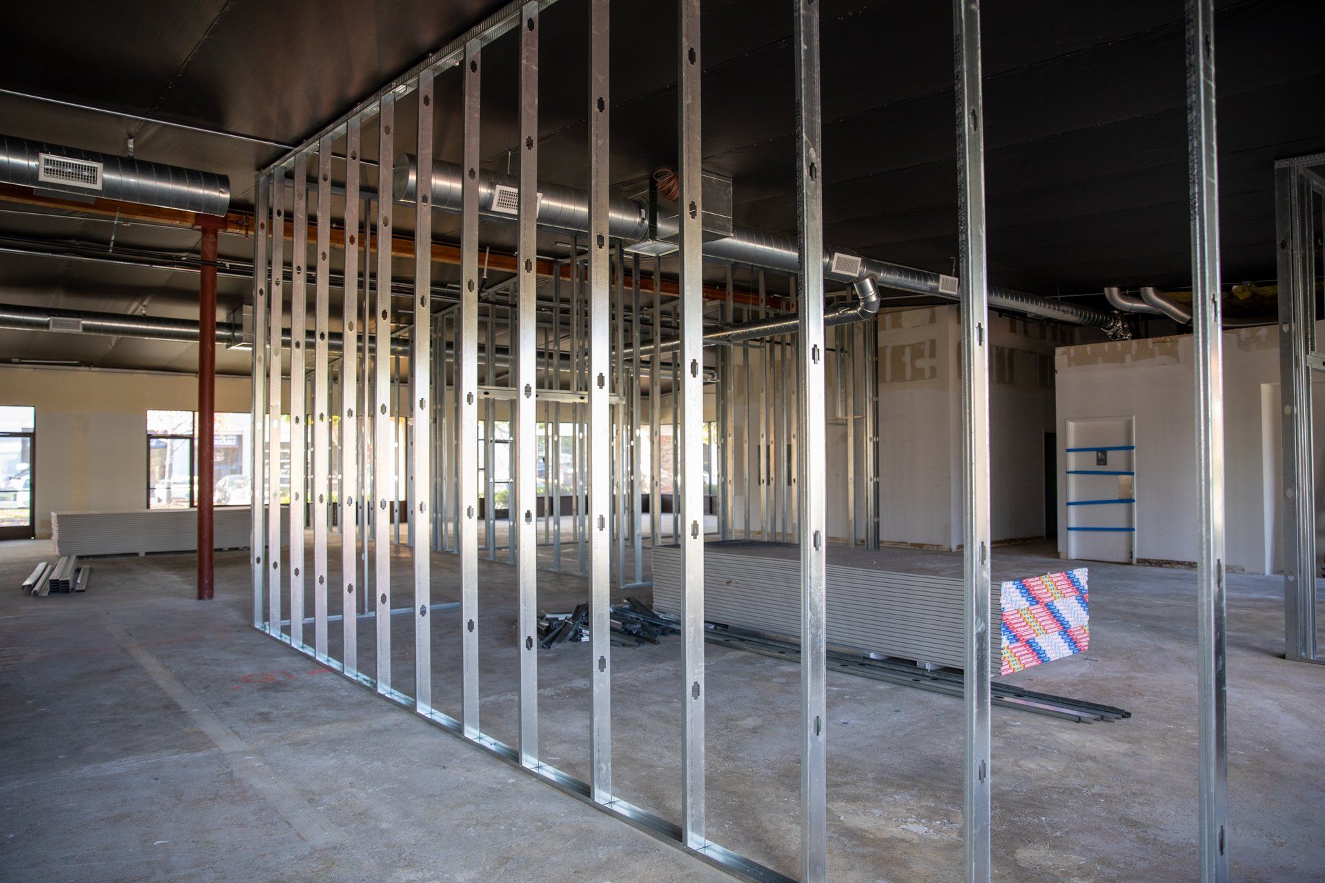A large room with a lot of metal frames on the walls