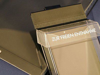 A clear plastic box with zur freien entnahme written on it