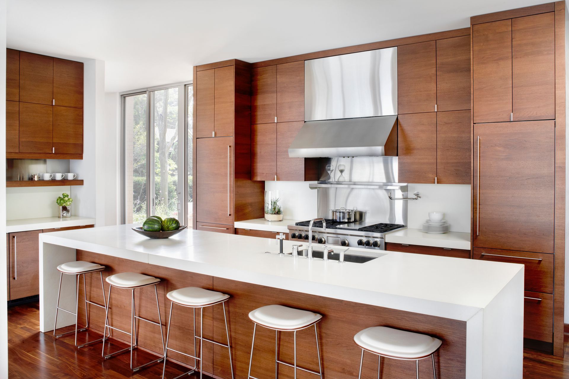A kitchen with stainless steel appliances and wooden cabinets