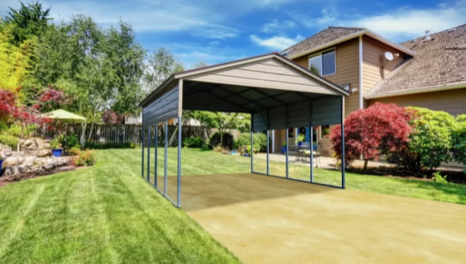 Carport in a backyard with a house, green grass, and blue sky.