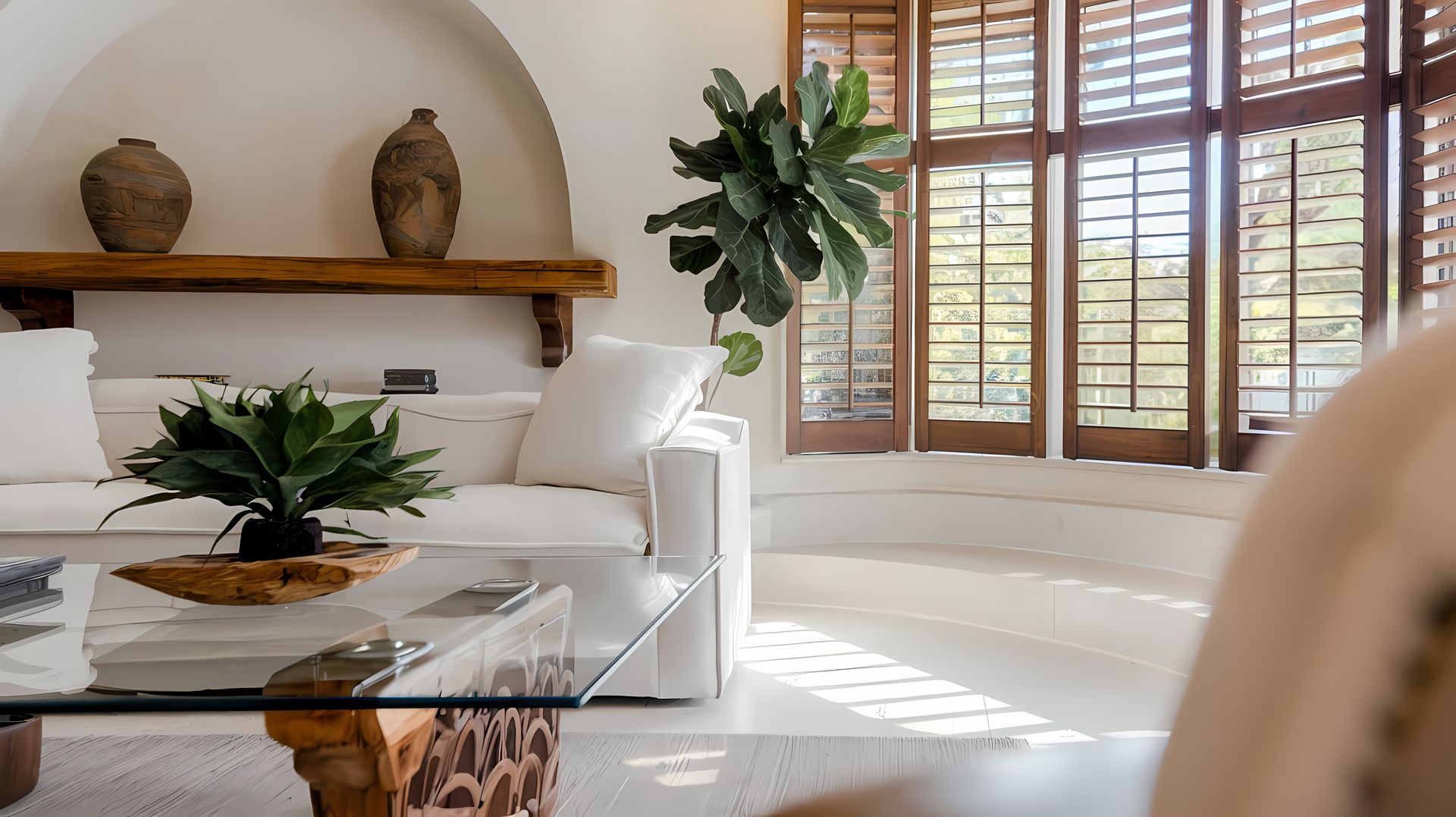 White living room featuring wood shutters near Marriottsville, MD.