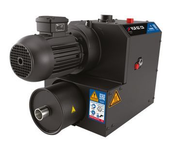Black industrial vacuum pump with motor, safety labels.