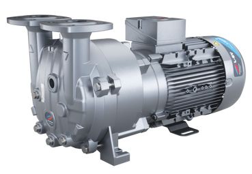 A silver industrial vacuum pump with an electric motor attached, sitting on a concrete surface.