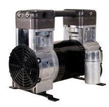 Silver and black air compressor with a fan guard, motor, and tank.