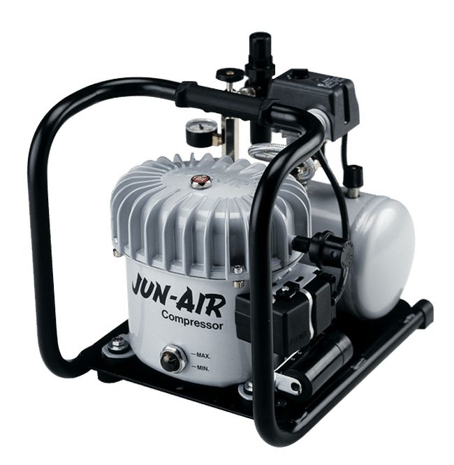 JUN-AIR air compressor, gray and black, with a handle and gauge, on a black base.