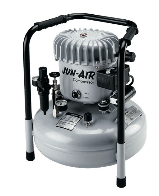 A gray JUN-AIR air compressor with a black frame, gauges, and a handle.