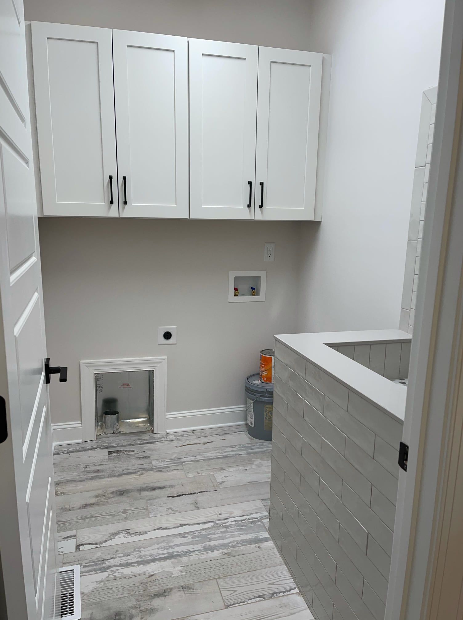 Newly installed cabinets in washroom