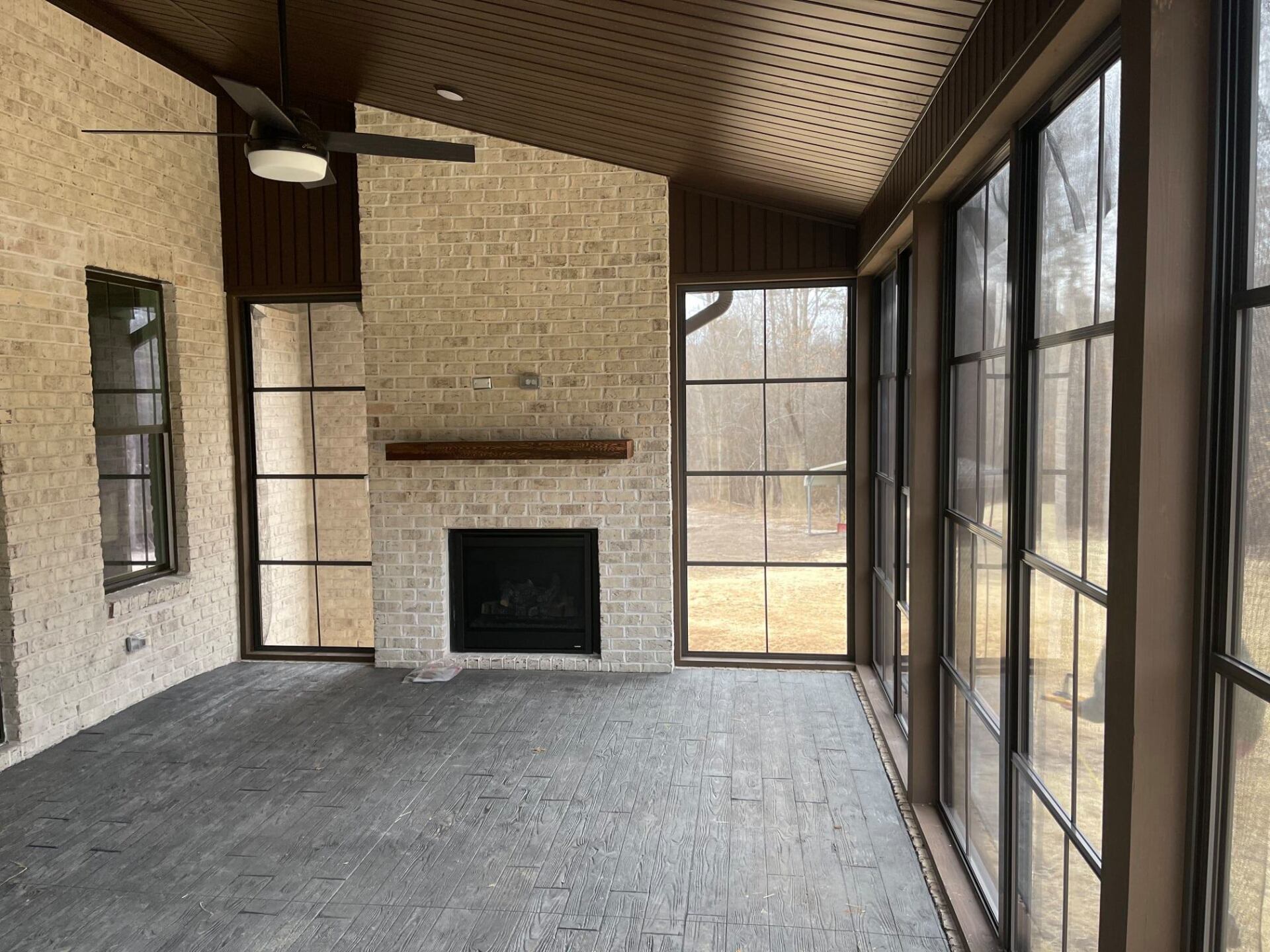 Custom fireplace in windowed room