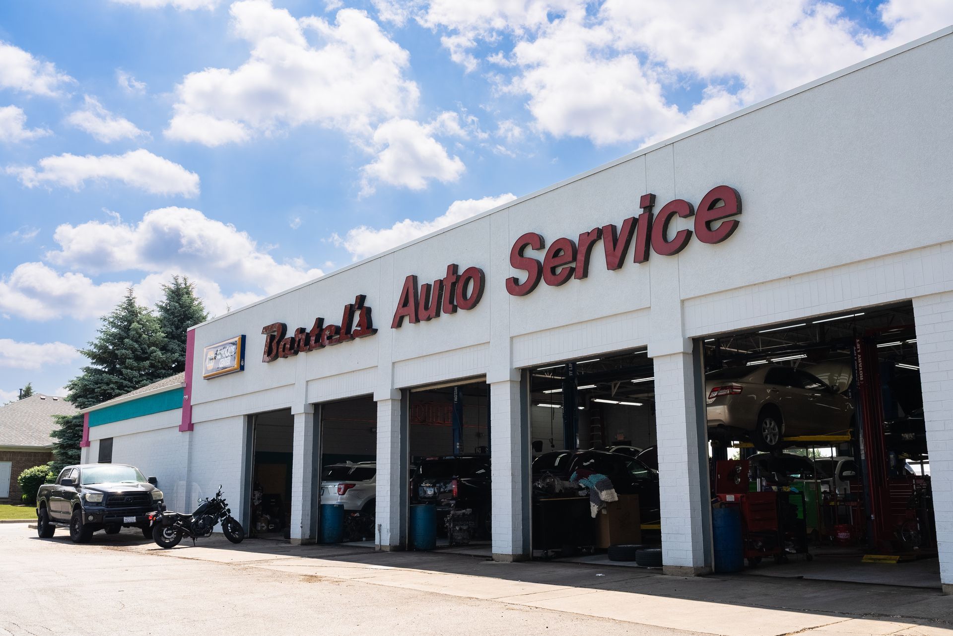 Vehicles Parked Outside Bartel’s Auto Service Garage | Bartel's Auto Clinic