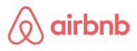 the airbnb logo is red and white on a white background .