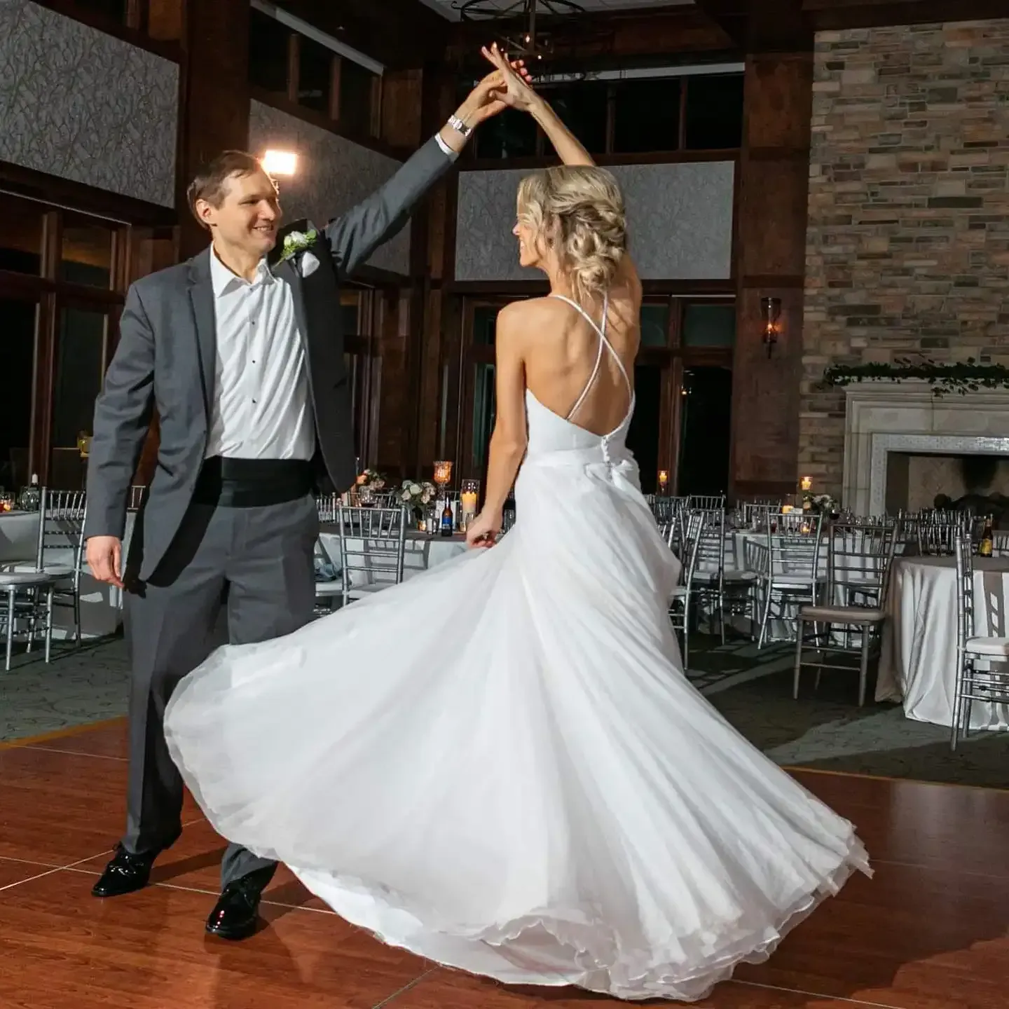 A bride and groom are dancing on a dance floor