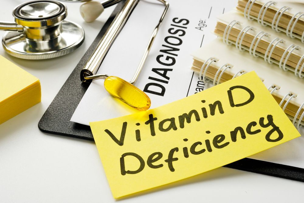 A note on a clipboard that says vitamin d deficiency