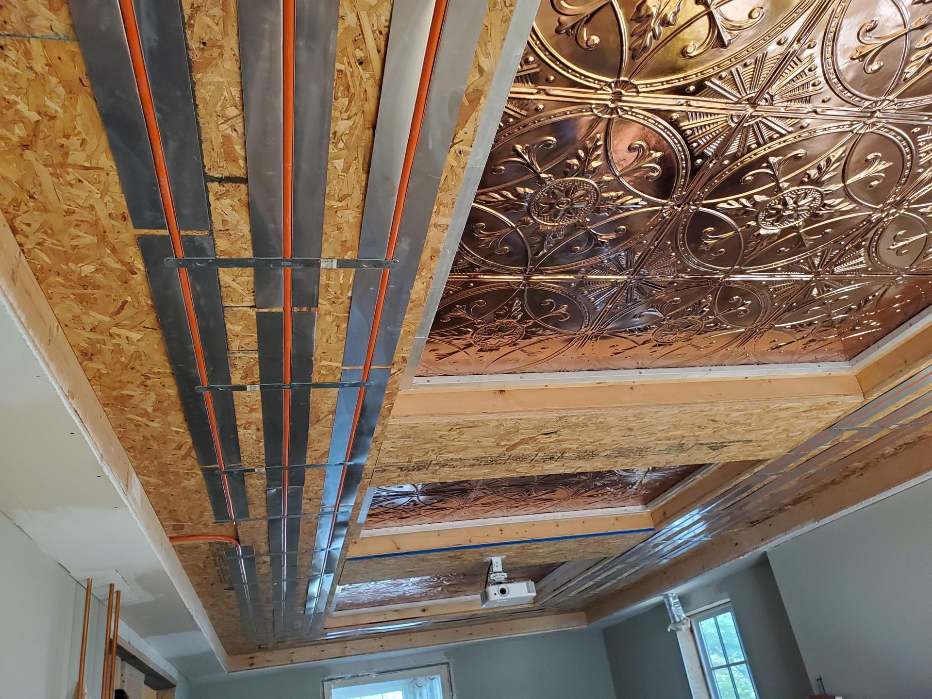 A room with a wooden ceiling and a copper ceiling