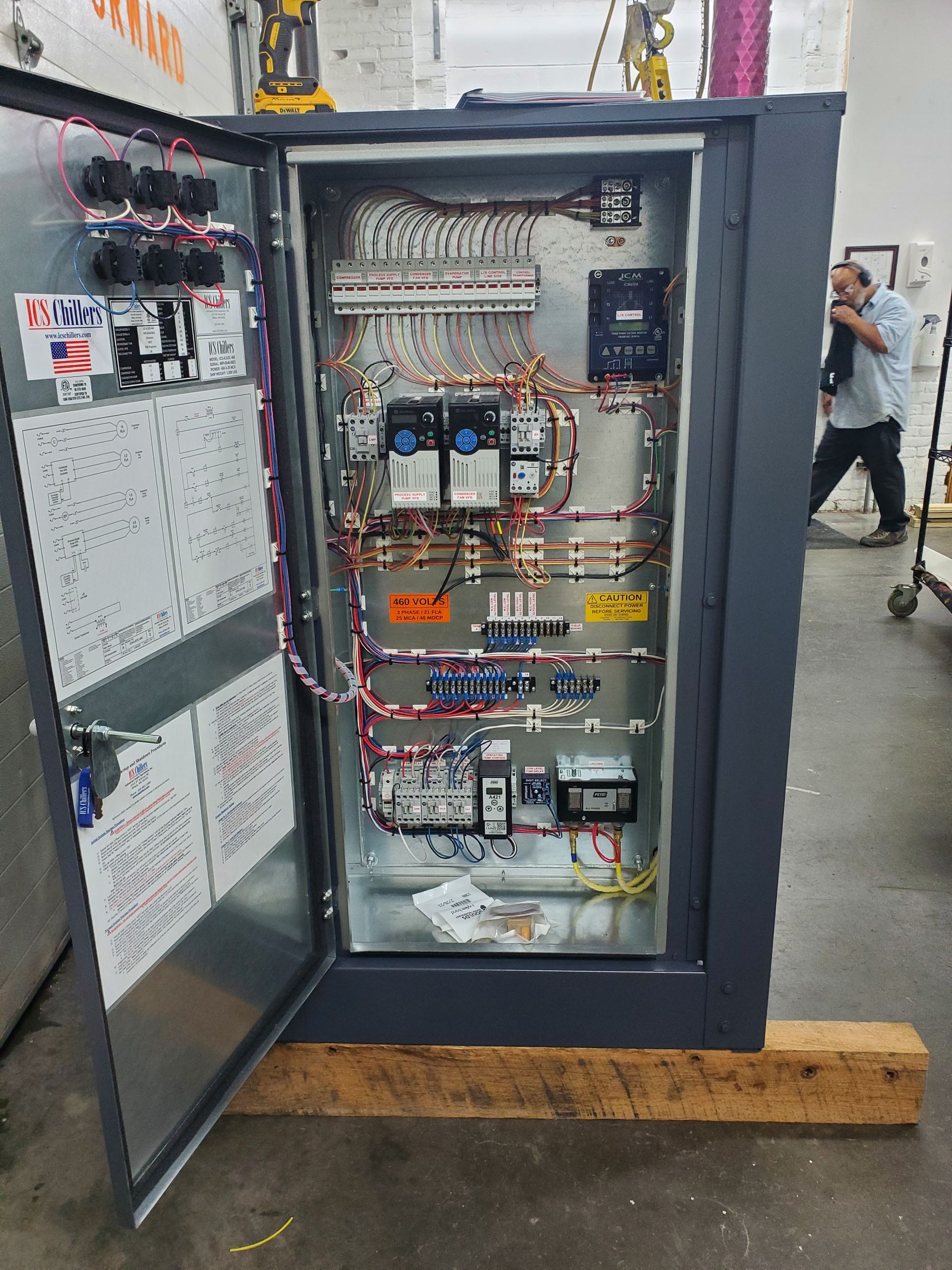 A large electrical box with a lot of wires coming out of it.