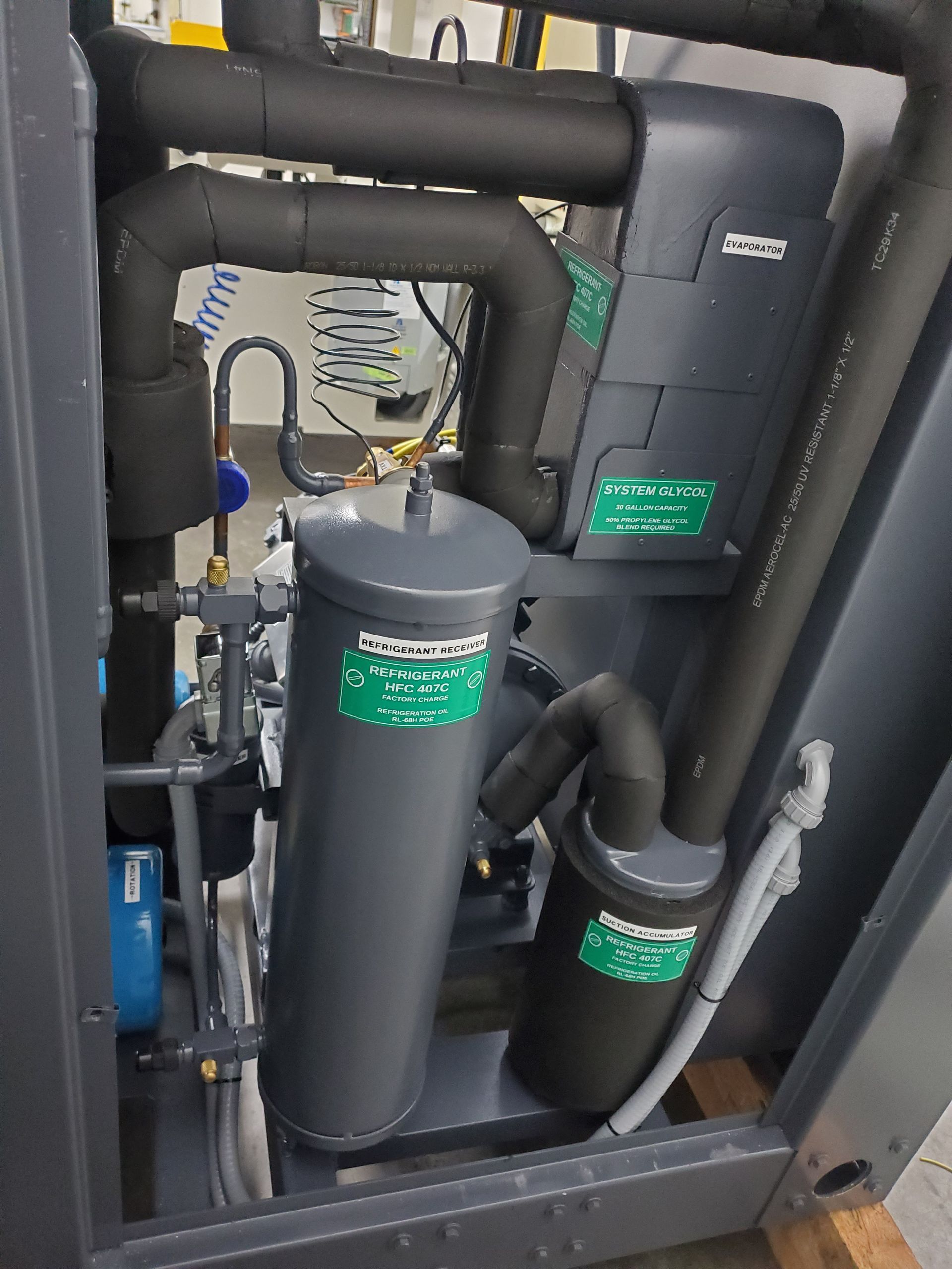 A close up of a machine with a lot of pipes coming out of it.