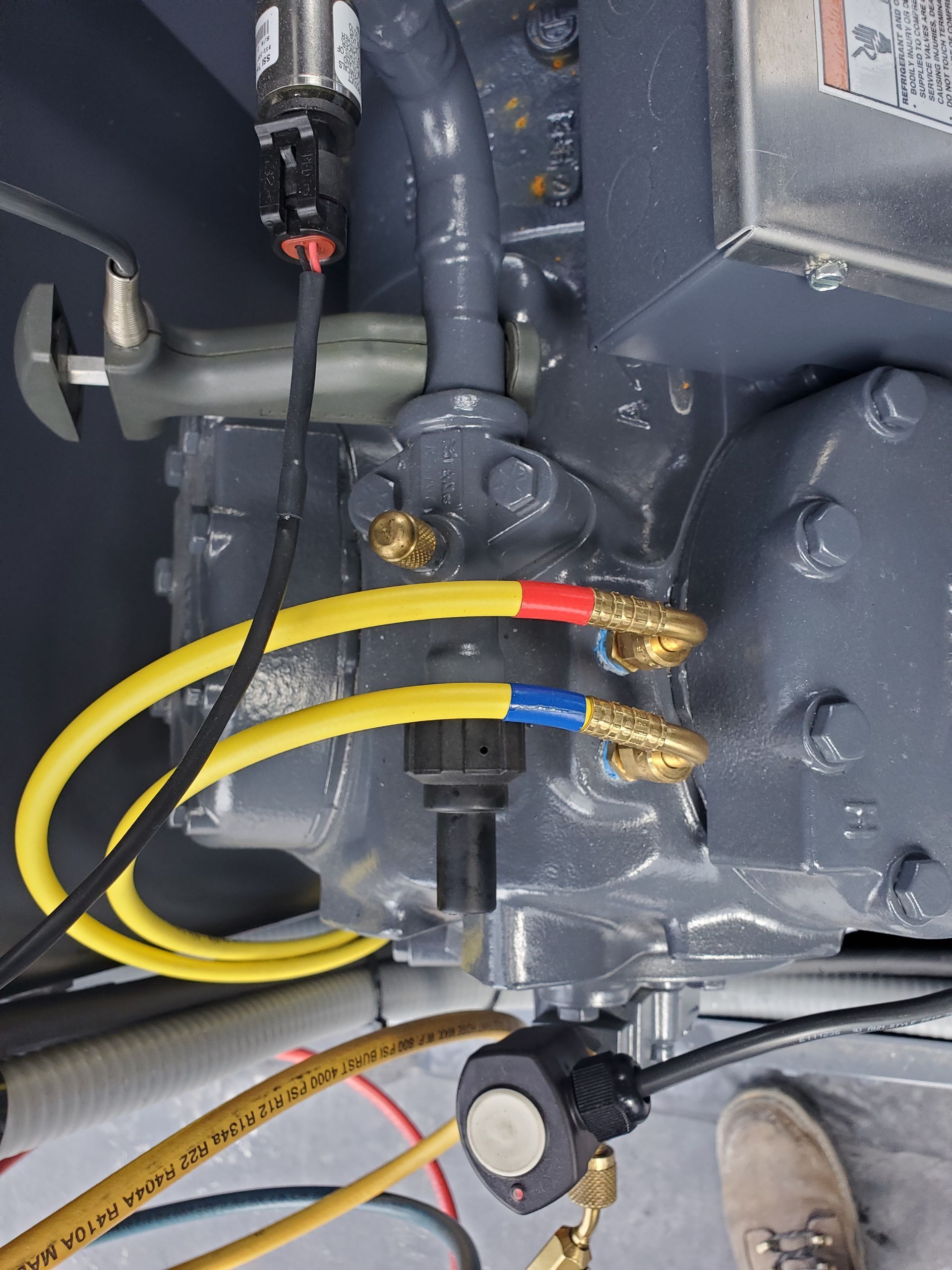 A close up of a machine with hose attached to it