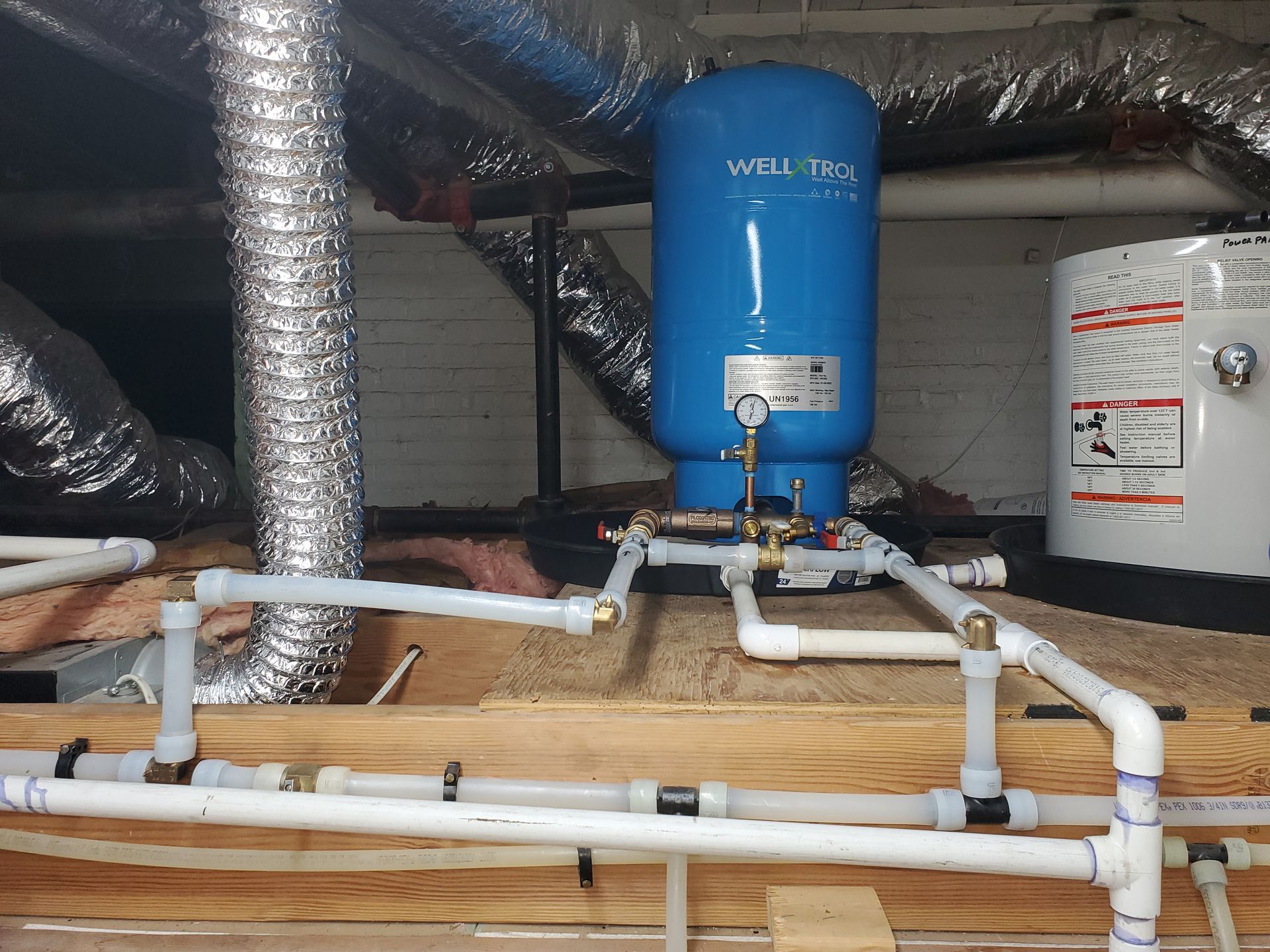 A blue water tank with the word welltec on it