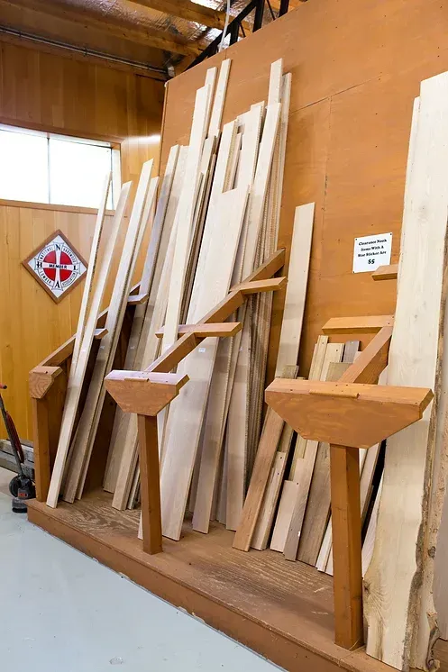 A living room with a couch , chairs , and a fireplace.
