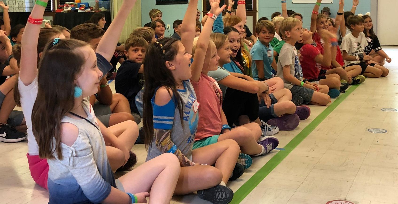 school children watching a magic show