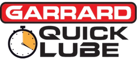 The logo for garrard quick lube has a clock on it