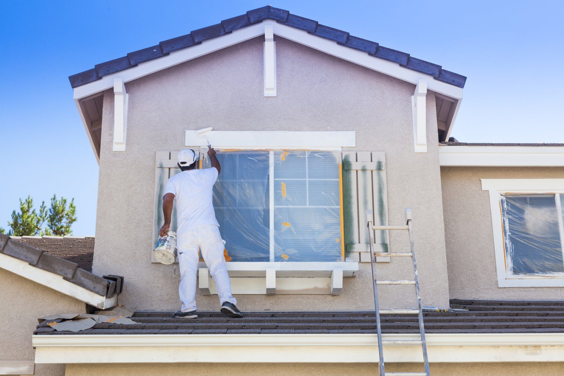 Residential Exterior Painting — Worker Painting The House in Vermilion, OH