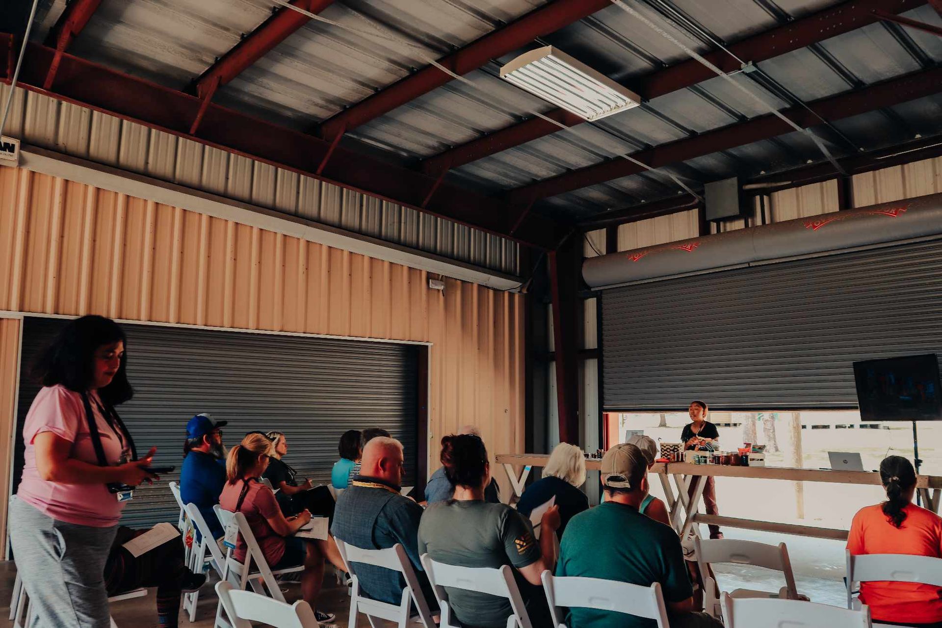 A group of people are sitting in chairs in a room.
