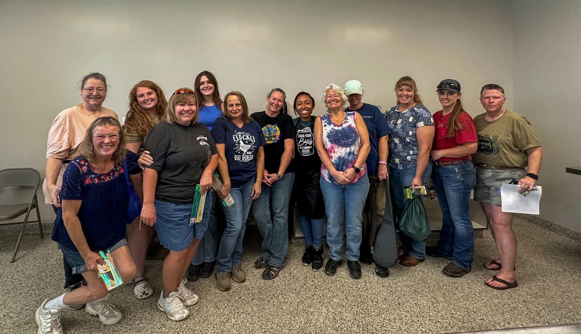 A group of people are posing for a picture in a room.