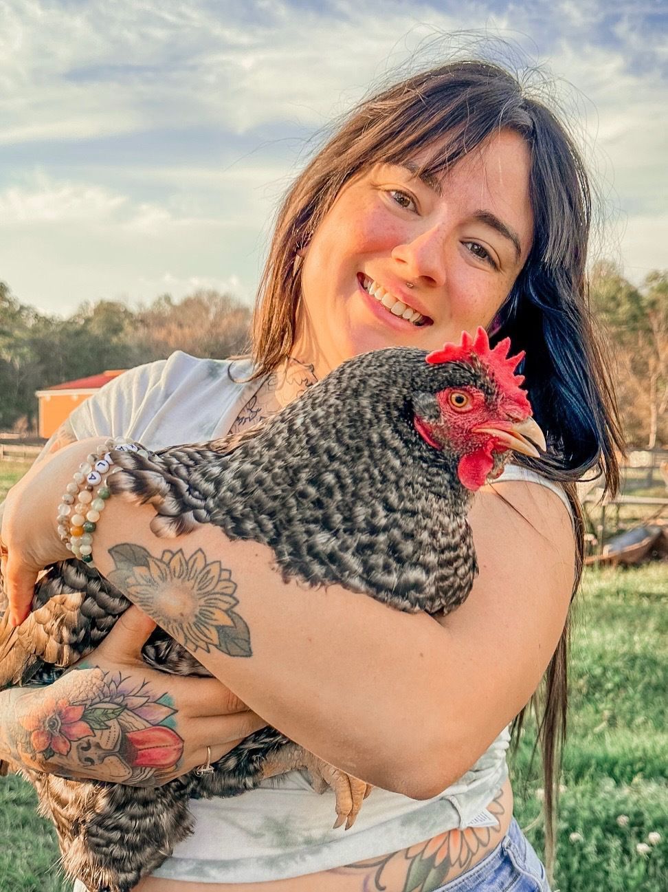 Member holding rooster