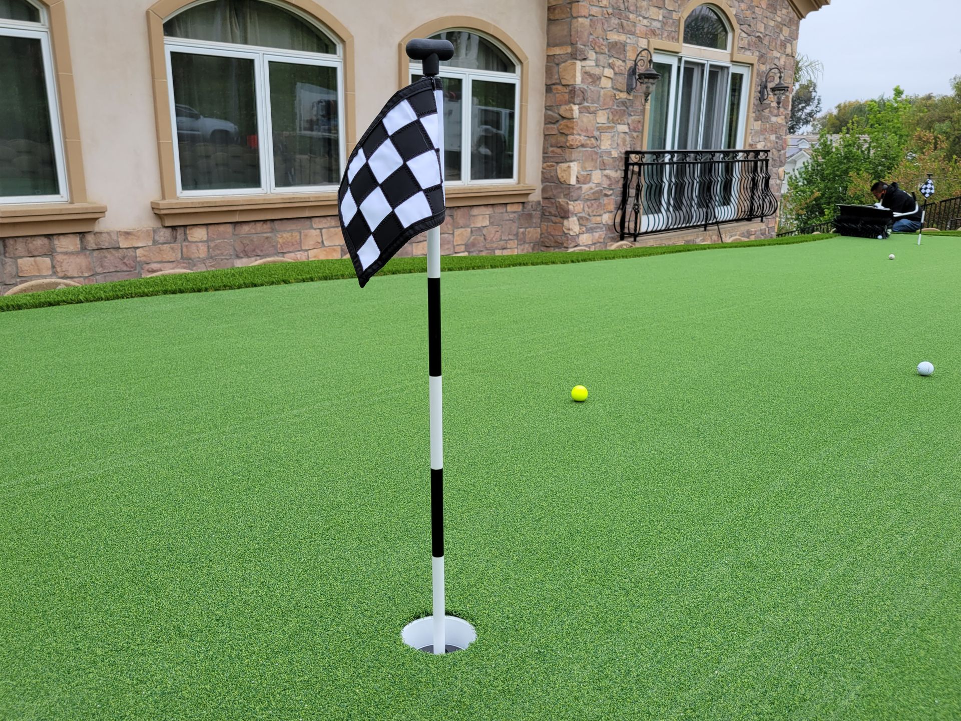 Checkered flag on synthetic putting green