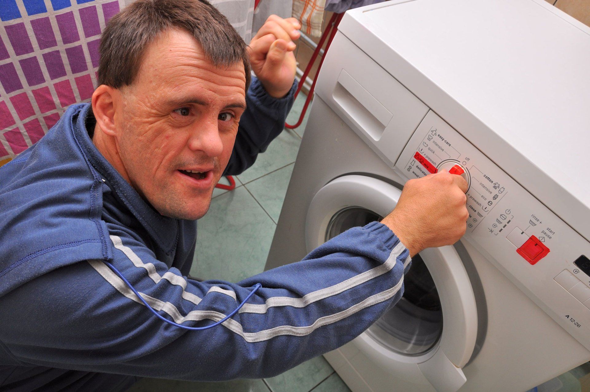 Man Using Wash Machine